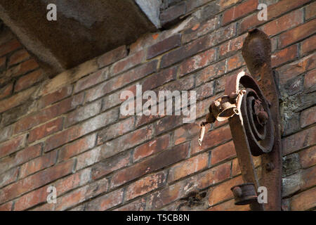 Background Of Old Vintage Dirty Brick Wall With Peeling Plaster, Texture. Shabby Building Facade With Damaged Plaster. Abstract Web Banner. Copy Space Stock Photo