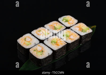 Homemade Shirmp Tempura Sushi Roll with Avocadosat black background Stock Photo
