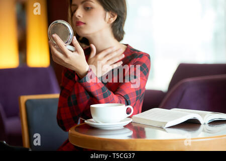 Woman checking bruce or pimple on neck Stock Photo