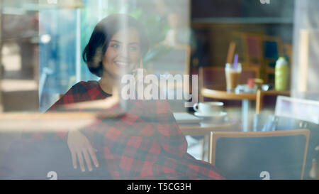 Positive woman talking on phone Stock Photo