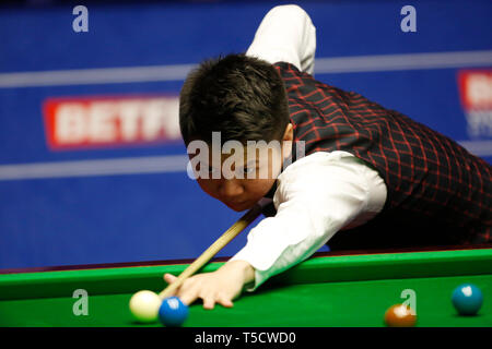 Sheffield. 23rd Apr, 2019. China's Zhou Yuelong competes during the first round first session with Northern Ireland's Mark Allen at the World Snooker Championship 2019 in Sheffield, Britain on April 23, 2019. Credit: Craig Brough/Xinhua/Alamy Live News Stock Photo