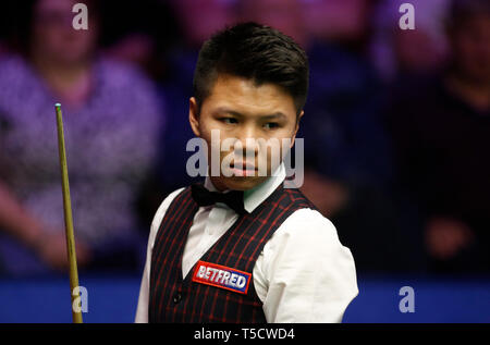 Sheffield. 23rd Apr, 2019. China's Zhou Yuelong competes during the first round first session with Northern Ireland's Mark Allen at the World Snooker Championship 2019 in Sheffield, Britain on April 23, 2019. Credit: Craig Brough/Xinhua/Alamy Live News Stock Photo