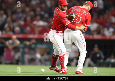 Anaheim, California, USA. 23rd Apr 2019. Los Angeles Angels shortstop David Fletcher (6) and Los Angeles Angels starting pitcher Chris Stratton (36) collide softly as they both try to field the unexpected bunt by New York Yankees shortstop Tyler Wade (14) during the game between the New York Yankees and the Los Angeles Angels of Anaheim at Angel Stadium in Anaheim, CA, (Photo by Peter Joneleit, Cal Sport Media) Credit: Cal Sport Media/Alamy Live News Stock Photo