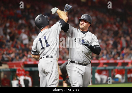 From left, New York Yankees' Anthony Rizzo, Aaron Judge and Giancarlo  Stanton celebrate in the locker room after the Yankees defeated Cleveland  Guardians in Game 5 of an American League Division baseball