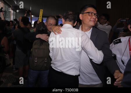 Hong Kong, CHINA. 24th Apr, 2019. One of the THREE KEY PERSON and the initiator of 2014 Occupy Central-Umbrella Movement, professor Chan Kin-man receiving hug from his supporter inside the entrance of West Kowloon Court. Key persons of the 2014 UMBRELLA MOVEMENT, Benny Tai, Chan Kin-man and Chu Yiu-ming are sentenced to 16 months in prison for the charges of 'causing public nuisance' during massive civil disobedience. Only sentence of Chu Yiu-ming ( 75 ) is suspended for 2 years for the reason of his old age.April-24, 2019 Hong Kong.ZUMA/Liau Chung-ren (Credit Image: © Liau Chung-ren/ZUMA Wir Stock Photo