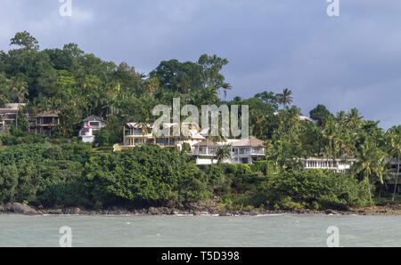 Houses and lighthouse at entry to Port Douglas, Queensland, Australia Stock Photo