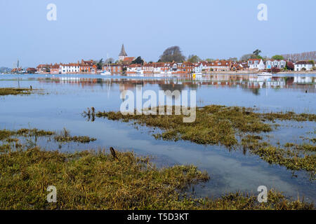 Village reflected in still waters of Bosham Creek at high tide in Chichester harbour. Bosham, West Sussex, England, UK, Britain, Europe Stock Photo