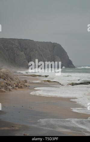 Wonderful Cliff On A Cloudy Day On Big Beach In Colares. Nature, architecture, history, street photography. April 13, 2014. Colares, Sintra, Lisbon, P Stock Photo