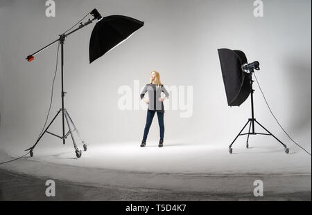 Studio photo with spotlights, girl in full growth. Stock Photo