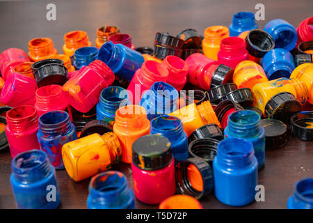 a lot of different paint cans opened on a mountain Stock Photo