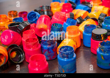 a lot of different paint cans opened on a mountain Stock Photo