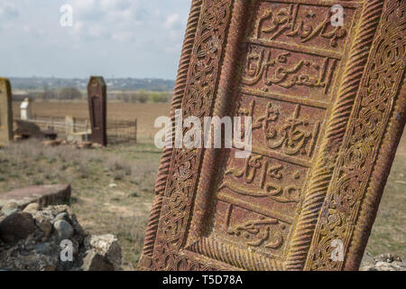 Ancient muslim cemetery near Agstafa, Azerbaijan with writings on farsi for graphic and web design, for website or mobile app. Stock Photo