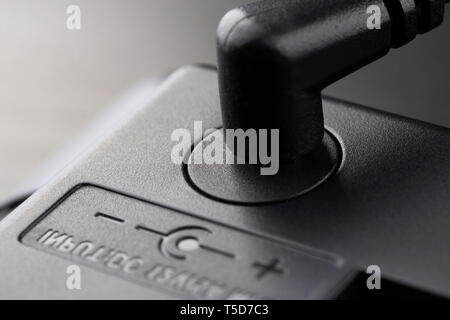 Inserted black 12 volt adapter plug. The wiring diagram is shown next Stock Photo
