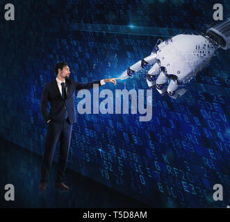 Man machine interaction between human and a digital hand Stock Photo