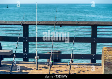 Fishing Rods on a Pier Stock Photo