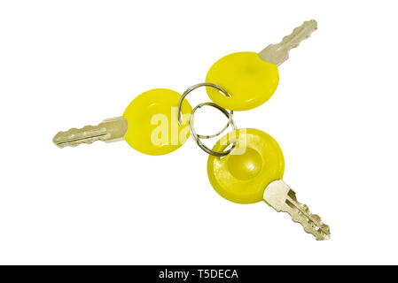 A bunch of three small keys isolated on a white background Stock Photo