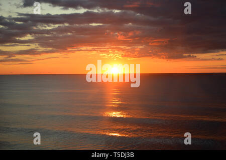 Orange sunrise over the Atlantic Ocean seen from a tall ship bow Stock ...