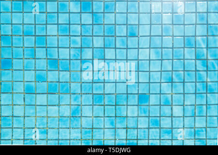 Blue ceramic tile mosaic in swimming pool - texture and background . Stock Photo