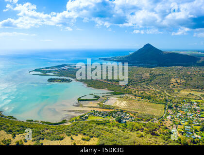 Aerial view of Mauritius island panoramic landscape with green meadows and mountain peaks Stock Photo