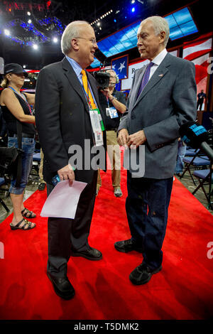 Republican strategist and political consultant Karl Rove talks with Senator Orrin Grant Hatch (Utah) at the GOP National Convention in Tampa Bay Forum. Stock Photo