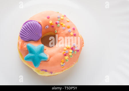 Donut on a white plate, donut with white background Stock Photo