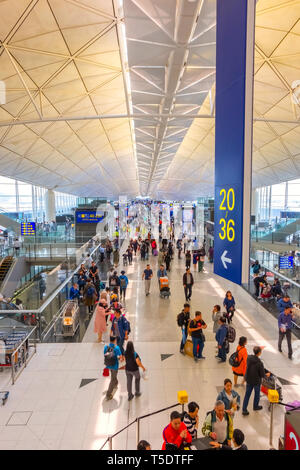 Hong Kong - April 19 2018:  Unidentified people at Hong Kong International Airport where it's the world's busiest cargo gateway and one of the world's Stock Photo