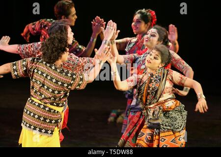 Indian folk dancers dance on stage performing Orissa regional folk dance Stock Photo
