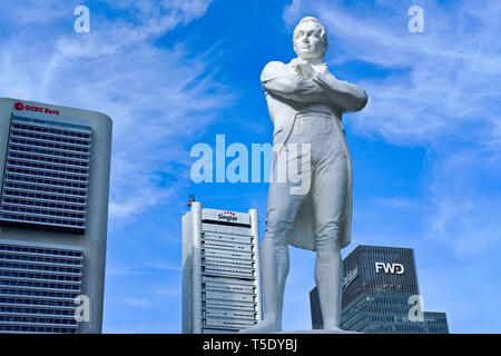 Statue of Sir Stamford Raffles at Raffles' Landing  Site by the Singapore River, high rise buildings of the business district in the b/g; Singapore Stock Photo