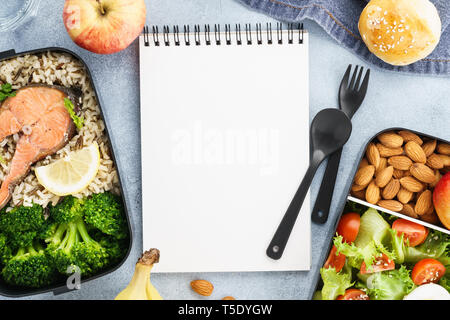Diet plan mockup with healthy lunch boxes and empty notepad. Space for text. Flat lay. Stock Photo