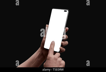 Woman hand touch isolated screen on modern smart phone with camera under display. Low light scene for app promotion. Stock Photo