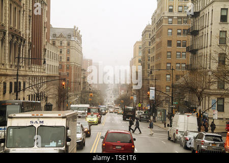 New York City, USA. Driving on Amsterdam Ave. in Manhattan, in a cold foggy day. Stock Photo
