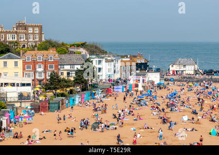 People enjoying the sun on the beach at Viking Bay, Broadstairs, during an unusually warm April 2019 Easter Monday Bank Holiday. Stock Photo