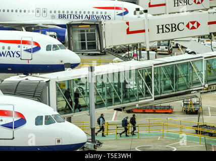 LONDON GATWICK AIRPORT, ENGLAND - APRIL 2019: Passengers disembarking a British Airways jet at Gatwick Airport's South terminal building Stock Photo