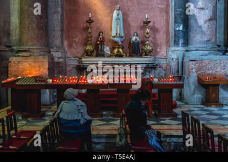 Votive candles in Igreja de Sao Domingos - National Monument church in Lisbon, Portugal Stock Photo