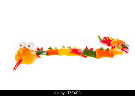 Snake carved from bell pepper - isolated on a white background Stock Photo