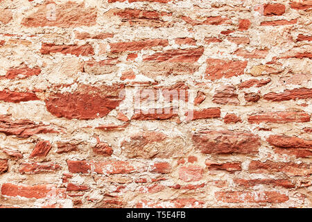 Red medieval brick wall background Stock Photo