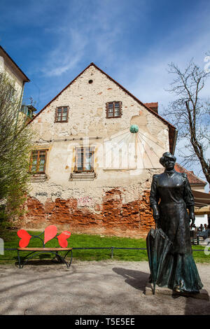 ZAGREB, CROATIA - APRIL, 2018: Statue of famous writer Marija Juric Zagorka and sun clock in Zagreb Stock Photo