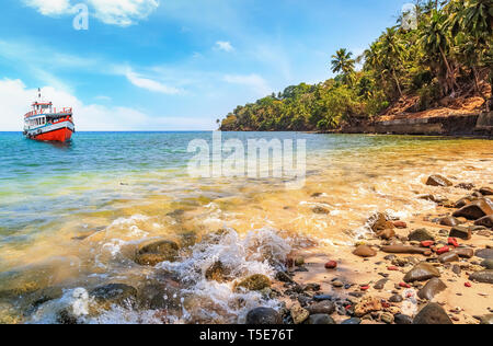 Scenic Ross island beach Andaman with view of the seashore and tourist boat. Stock Photo