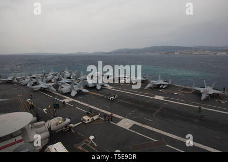 190420-N-PW030-1007 MEDITERRANEAN SEA (April 20, 2019) The Nimitz-class aircraft carrier USS Abraham Lincoln (CVN 72) departs the coast of Palma de Mallorca, Spain after a scheduled port visit. Abraham Lincoln is underway as part of the Abraham Lincoln Carrier Strike Group deployment in support of maritime security cooperation efforts in the U.S. 5th, U.S. 6th and U.S. 7th Fleet areas of operation. With Abraham Lincoln as the flagship, deployed strike group assets include staffs, ships and aircraft of Carrier Strike Group (CSG) 12, Destroyer Squadron (DESRON) 2, USS Leyte Gulf (CG 55) and Carr Stock Photo