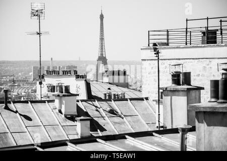 Eiffel tower seen over Paris rooftops Stock Photo