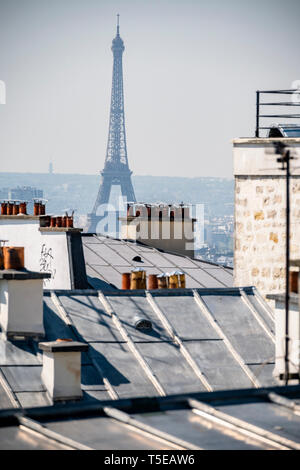 Eiffel tower seen over Paris rooftops Stock Photo