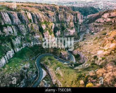 Aerial drone photo of Cheddar Gorge, Somerset UK. Taken at sunrise to capture the warmth of the light coming through the gorge and light on the rocks Stock Photo