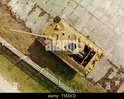 Aerial Image of the historical most popular old T-34  soviet tank. Ussr famous tank with damaged engine on exhibition Stock Photo