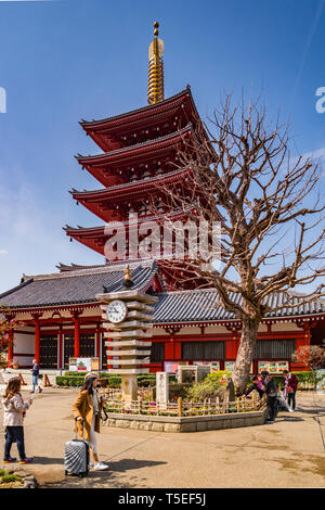 25 March 2019: Tokyo, Japan - The Five-Storey Pagoda and clocktower at Senso-ji Buddhist Temple, Tokyo. Stock Photo