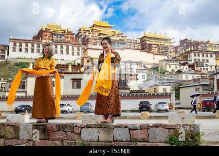 Songzanlin Tibetan Buddhist Monastery reflected in sacred lake, Shangri-La, Yunnan Province, China Stock Photo