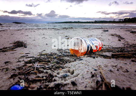 A plastic Gatorade bottle lays on the beach, April 19, 2019, in Dauphin Island, Alabama. Stock Photo