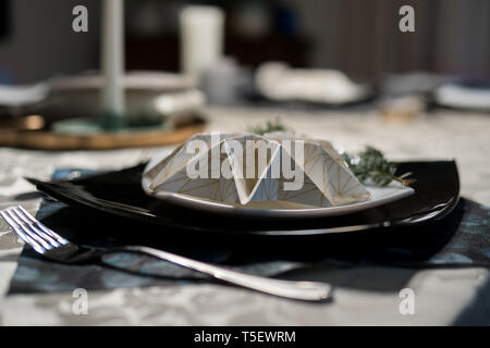 elegant table setting with decoration for dinner in regular home Stock Photo