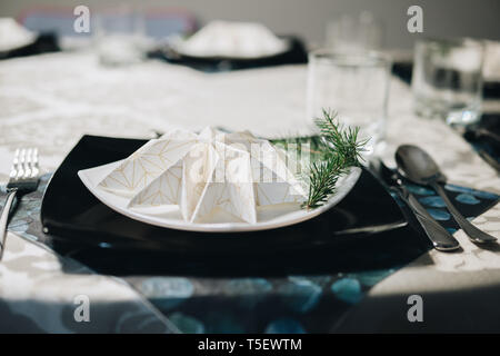elegant table setting with decoration for dinner in regular home Stock Photo