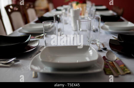 elegant table setting with decoration for dinner in regular home Stock Photo