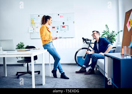 Two colleagues with tablet meeting in office Stock Photo